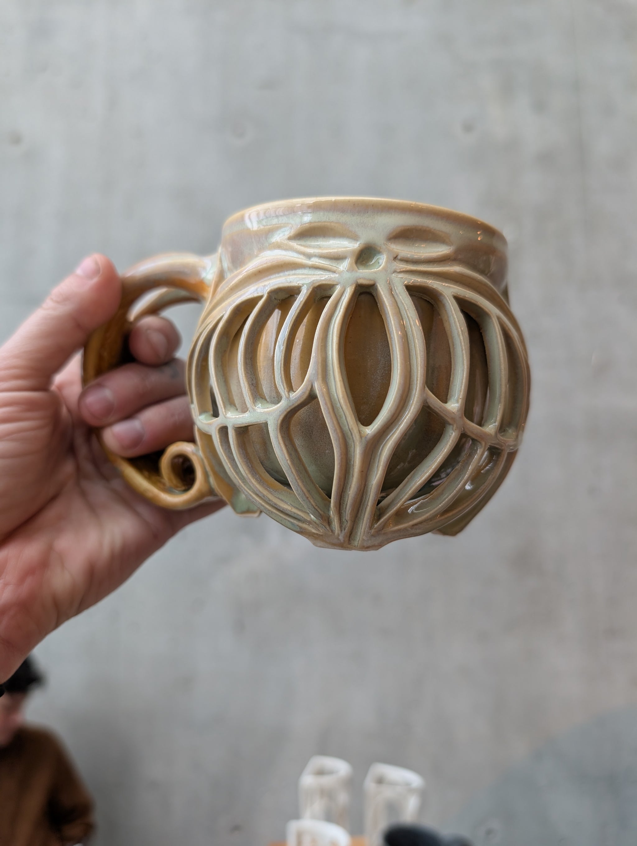 Double walled, carved ceramic mug made by NY artist Jordan Coons