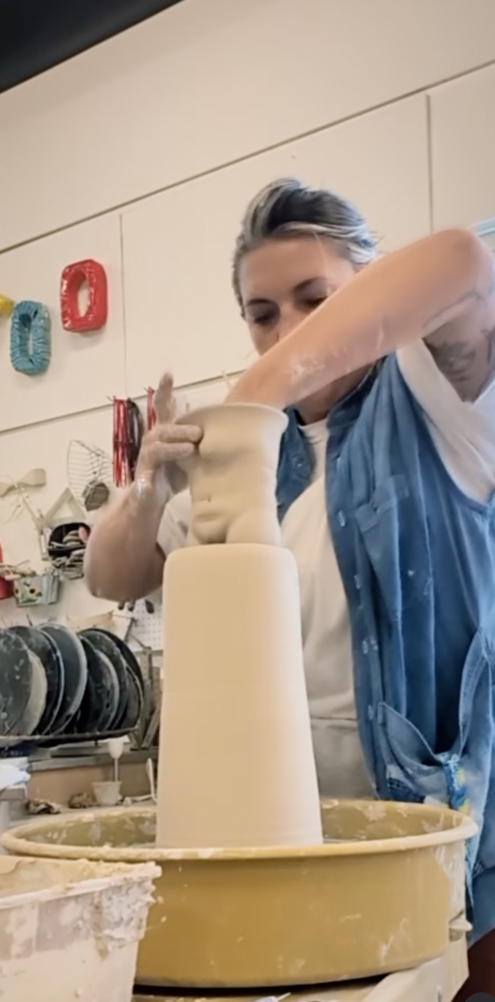 Ceramic artist Jordan coon creating a double walled clay vase.